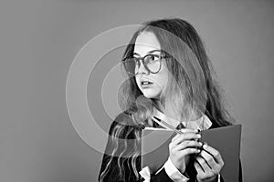 Be smarty. Smart girl brown background. Little girl back to school. Small girl read book in glasses. Primary school girl