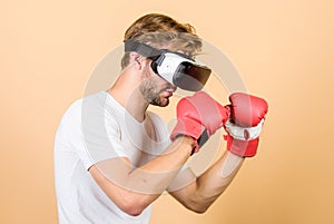 Be strong. man in VR glasses. Futuristic gaming. vr boxing. future innovation. modern gadget. Training boxing game
