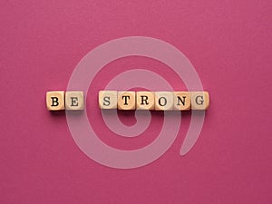 Be strong written with small wooden blocks