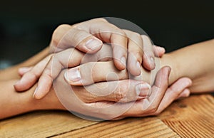 Be there for those who need you. Cropped shot of two people holding hands in comfort.