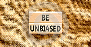 Be unbiased symbol. Concept words Be unbiased on wooden block. Beautiful canvas table canvas background. Business psychology be