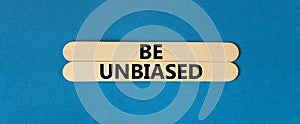 Be unbiased symbol. Concept words Be unbiased on wooden sticks. Beautiful blue table blue background. Business psychology be