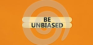 Be unbiased symbol. Concept words Be unbiased on wooden sticks. Beautiful orange table orange background. Business psychology be