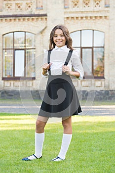 Be well. vintage kid fashion. small student girl relax on green grass. back to school. little girl looking smart and