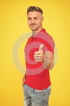 Be your best. Happy guy give thumbs up yellow background. Approval gesture. Hand sign. Casual fashion. Trendy style