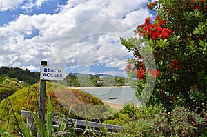 Beach Access Sign at Kaiteriteri Beach, New Zealand.