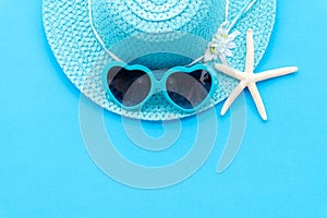 Beach accessories including starfish, blue sunglasses