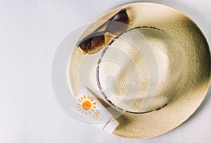 Beach accessories. Summer hat, sunglasses and suntan lotion