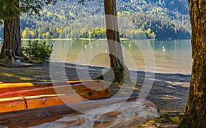 Beach activity, kayaking and boating. Rowing equipment. Colorful canoes at the Cultus Lake BC