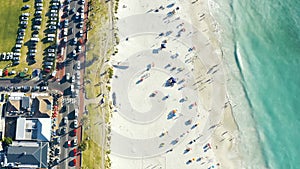 Beach, aerial drone and tourist with sea, crowd and vacation travel group in Cape Town. Relax, seaside and summer with a