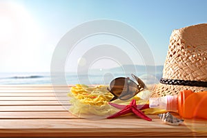 Beach articles on a table wooden slats and sea background