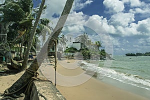 The beach of Axim city overlooking the sea and the castle. photo