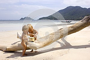 Beach babies with coconut