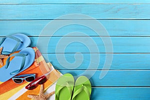 Beach background, copy space, flip flops, sunglasses