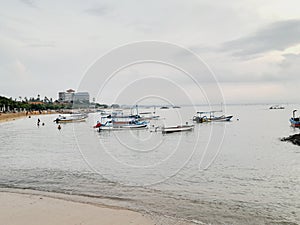 Beach background filled with ships and buildings around it