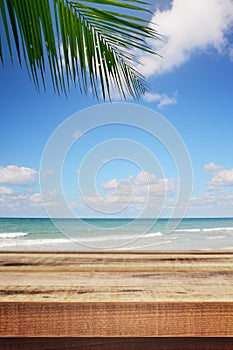 Beach background with palm tree and empty wooden, Summer.