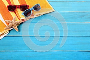 Beach background, sunglasses, blue wood deck, copy space