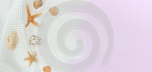 Beach background, top view. Seashells on a pink background
