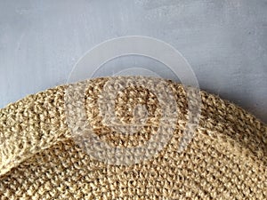 Beach bag made of blue and beige jute, crocheted