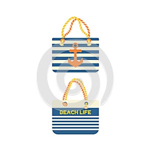 Beach bag in a stripe with an anchor. Beach set for summer trips. Vacation accessories for sea vacations