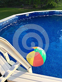 Beach Ball Floats on Surface of Above-Ground Swimming Pool