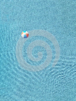 beach ball in a pool (water, minimalist, summer swimming pool party) ripples