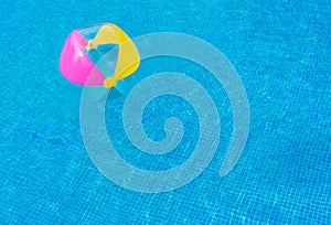 Beach ball in swimming pool