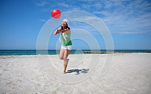 Beach ball woman jumping