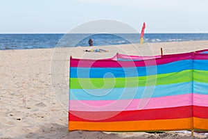 Beach on the Baltic Sea, Beginning of summer season during the coronavirus pandemic, Screens diving sunbathers. Miedzyzdroje,