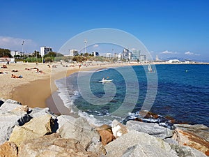 Beach in Barcelona with blue sea and rocks