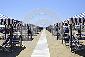 Beach with beach umbrellas in Versilia. Viareggio, Tuscany, Ital