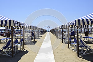 Beach with beach umbrellas in Versilia. Viareggio, Tuscany, Ital photo