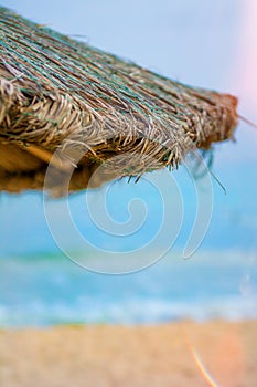 Beach beautiful thatched umbrellas and bright turquoise sea, great recreation and relaxation. tropical paradise.