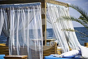 Beach bed and sunloungers in a beach