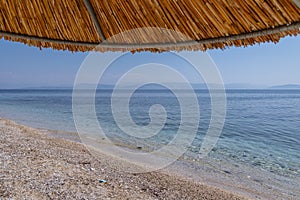 Beach in Benitses town, Corfu, Greece