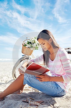 Beach bicycle woman reading book