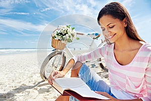 Beach bicycle woman reading book