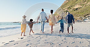 Beach, big family and holding hands while walking in nature for travel, love or freedom. Back, support and children with