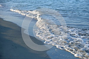 Beach of Black Sea with smooth wave and sand texture background.