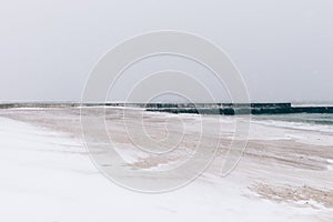 Beach during a blizzard and snowfall, minimalist landscape