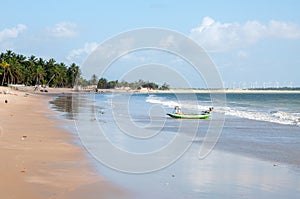 Beach with boat at low tide, Pititinga, Natal (Brazil)