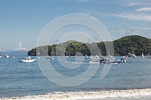 Beach with boats on the coast on a sunny day in Guanacaste in Costa Rica