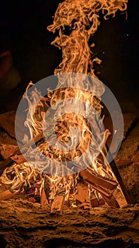 Beach Bonfire Burning Bright in the Darkness of Night. Monterey, CA