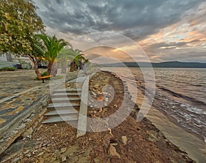 Beach with Boulevard in small town in Greece