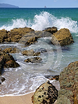Beach: breaking waves rock