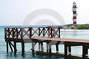 Beach bridge and lighthouse in Cancun, Mexico