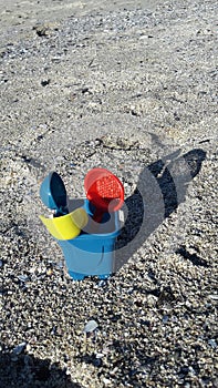 Beach Bucket and spades on sea sand
