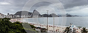 Beach, building, hotels, condos, mountains in Rio de Janeiro, Brazil on a cloudy day