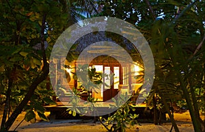 Beach bungalow at sunset - Maldives