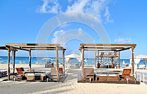 Beach cabanas on a white sandy beach